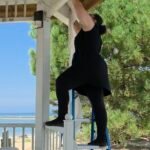 Hanging ceremony decor at a beachside pavilion overlooking the lake